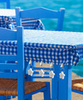 Starfish Tablecloth Weights Set With Metal Clips, Durable Table Cover Hangers for windy outdoor picnics, blue checkered cloth.