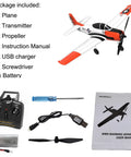 Beginner Friendly RC Airplane With XPilot Stabilization System T28 Trojan kit contents including plane, remote, and manual