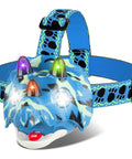Dino Themed LED Headlamp for Kids and Adults with Four Modes, triceratops design, adjustable strap, ideal for outdoor activities.