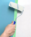 Pro Grade Paint Roller Kit With Solid Frame And Click Swap Sleeves For Flawless Wall Painting and Crisp Edging, applying blue paint.