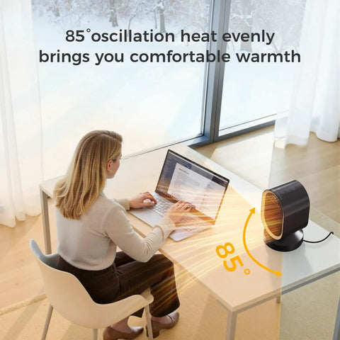 Indoor Space Heater 1500W Ceramic PTC With Thermostat And 24Hour Timer, Instant Two Second Heat on desk beside woman working