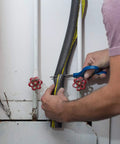 Person installing Insulating Foam Pipe Covers 0.75 Inch By 3 Feet Pack Of 4 Sticks Self Sealing Pre Slit on pipe