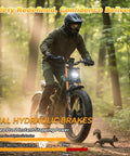 King Of The Road Dual Motor Electric Bike For Adults With Blazing 4000W Peak Power and Massive 52V 70Ah Battery on a forest trail.