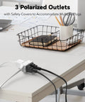 6 Ft Indoor Extension Cord With 3 Outlets Polarized 2 Prong Plug 2 Pack White Built For Home Office Lamps Fans Holiday Lights And Everyday Power Needs, shown plugged into a desk outlet.
