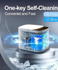 Self Cleaning Portable Countertop Ice Maker Spits Out Nine Bullet Cubes In Six Minutes With Smart Touch Panel And Two Liter Tank close-up of self-cleaning feature with water swirling inside.