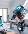 Bad Boy 18V Cordless Blower And Vacuum with Slick Nozzle Swap in hand, battery attached, working on debris removal.
