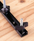 Close-up of 4 Piece 48 Inch Aluminum T Track Set for Woodworking Jigs and Fixtures with Screws, installed on workbench
