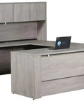 Slick Gray Oak U Shaped Electric Sit Stand Desk With Hassle Free Height Adjustment Includes Overhead Hutch and Locking File Cabinets.
