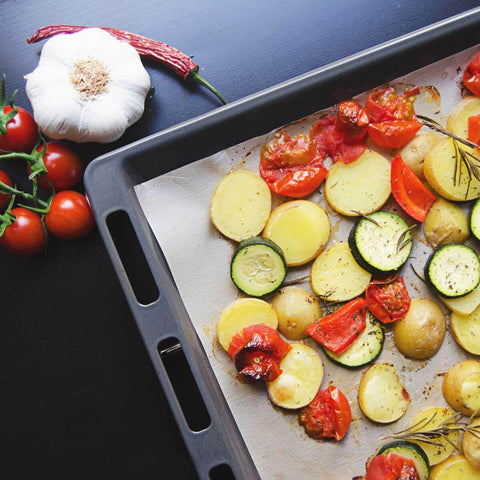 Set Of 3 Reusable 13 By 16 Inch Baking Mats, Nonstick PTFE Teflon Coated, Reversible Oven Safe Sheets in use with vegetables