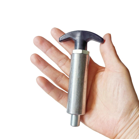 Heavy Duty Spring Loaded Pull Pin With Extended Welded Steel Barrel And Sure Grip Black Handle held in hand for size comparison.