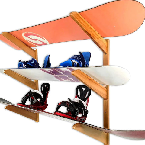 Premium Heavy Duty Solid American Oak Snowboard Wall Rack Holds Three Boards Securely with Extra Stash Zone for Helmets Goggles and Ski Poles for Your Garage or Man Cave Flex Display, showcasing snowboards and bindings.
