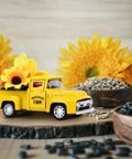 Yellow diecast pickup with sunflowers from Sunflower Metal Farm Truck Decor Set Of Four With Large And Mini Sunflowers Vintage Diecast Style Pickup