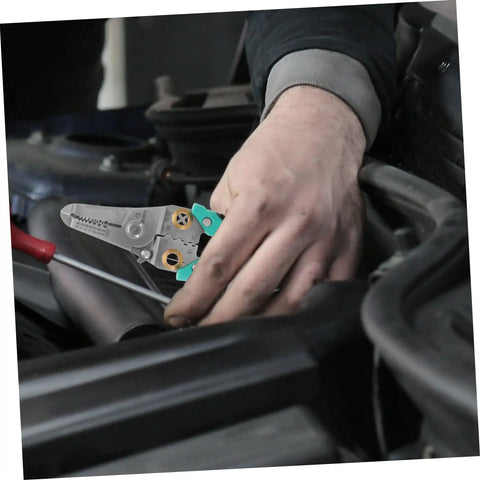 Heavy Duty Insulated Wire Strippers Pro Grade Electrical Pliers in hand, used for automotive repair and wiring tasks.