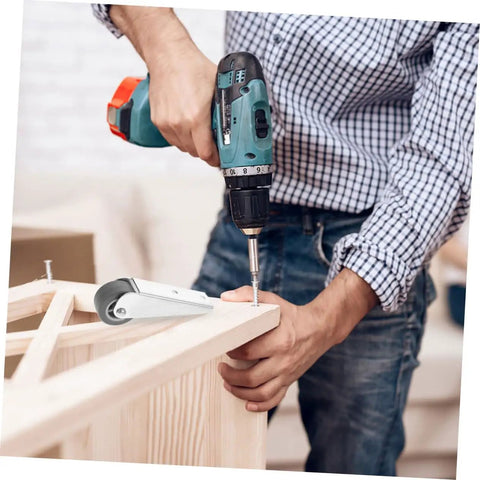 Man installing Galvanized Sliding Door Rollers And Quiet Caster Wheels For Barn And Wardrobe Doors with electric drill.