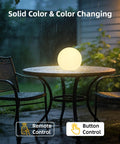 4 Inch Cordless LED Cube Night Light With 16 RGBW Colors And Remote Control Rechargeable Battery Mood Lamp glowing outdoors on a table