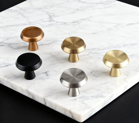 10 Pack Champagne Bronze Cabinet Knobs, 1.4 Inch Round Cabinet Pulls, zinc alloy handles displayed on marble surface