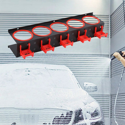 Rock Solid Iron Spray Bottle Storage Rack Featuring Five Heavy Duty Industrial Hooks mounted on a wall, holding spray bottles for car detailing.