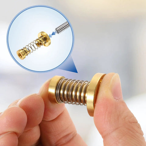 Close-up of a hand holding a Tr8x4 POM Anti Backlash Spring Loaded Nut 4 Pack Elimination Gap Nut with Acme Thread.