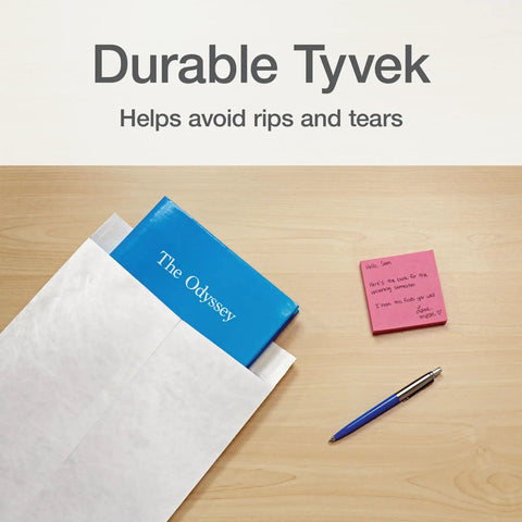 Self Sealing Tyvek Mailers Built Tough For Real Shipping Protection, Lightweight 14 Lb DuPont Material, Moisture And Tear Resistant 10x13 White Catalog Envelopes, 100 Pack, Perfect For Secure, Protective Shipments. Mailer showing book inside on a desk with pen and sticky notes.