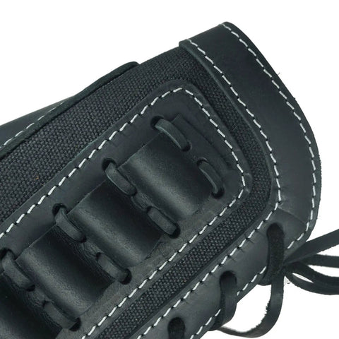 Close-up of rugged leather canvas buttstock with shell holder sling for 12 gauge shotgun in black, stitching detail visible.