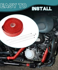 Badass Titanium Fiberglass Exhaust Heat Wrap 16 4 Ft Thermal Insulation For Cars Trucks And Motorcycle Engines Handles 2000 Degrees With Beefed Up Steel Cables In Red displayed on motorcycle exhaust.