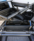 Built Tough 23.5 Inch Powder Coated Aluminum Ladder Roller With T Slot Compatibility For Roof Racks And Pickup Trucks in use, mounted in truck bed.