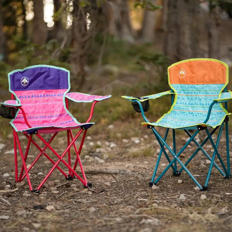Two Kids Glow In The Dark Camping Chairs With Cup Holder And Carry Bag, colorful designs, set on a forest ground for outdoor use.