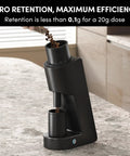Rock Solid Single Dose Coffee Grinder With Brawny 38 Mm Conical Burrs And Butter Smooth Stepless Dial For Bold Espresso Pour Over Pulls Low Retention Anti Static Frame In Matte Black, pouring coffee beans.