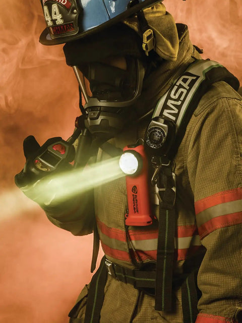 Firefighter using Survivor 175-Lumen Rechargeable Firefighter Right-Angle Flashlight, Intrinsically Safe Class I Div 1, Rugged Orange Body