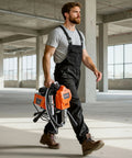 Man carrying Heavy Duty Stand Airless Paint Sprayer With 1500W Motor And 3300 PSI Pressure, ready for paint job.