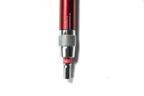 Close-up of T Ratchet Torque Kit With Titanium Torsion Beam showing adjustable scale and grip area in red finish