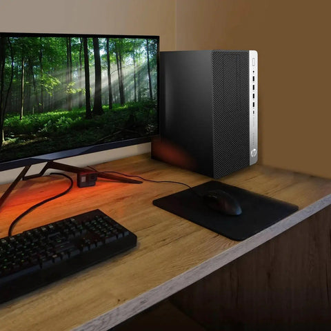 ProDesk 600G4 Tower Desktop Computer With Intel Core i7-8700 3.4 GHz, 16GB DDR4 RAM on a wooden desk next to a monitor