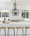 Go-To Industrial Black Four-Light Pendant With Candle-Style Cage Chandelier in white kitchen over island