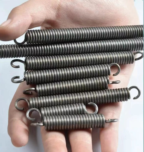 Heavy Duty Dual Hook Tension Springs Made From Spring Steel That Are Just The Right Size At 3.5mm Wire And 18M Outer Diameter held in hand.