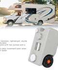 25L Portable RV Waste Tote Tank Made From HDPE next to RV, showcasing ease of transport, durability, two pulleys, and a grip.