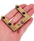 Heavy Duty Bronze Pivot Door Hinges Set With Hidden Self Closing Hardware displayed on hand.