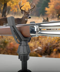 360 Degree Rotating V Yoke Rifle Rest for shooting sticks attached to a tripod, in a hunting scenario with a deer in background.