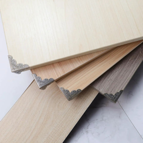 Heavy Duty Antique Corner Protectors 48 Pack Vintage Bronze Furniture Edge Guards For Diy Crafts on wooden boards.