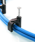 100 Pack Nail In Cable Clips Set for 8mm Wire With Zinc Plated Nails securing blue cables, close-up view