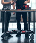 Heavy Duty Four Inch Swivel Caster Wheels With Non Marking Rubber Tires And 7/16 Inch Threaded Stems on a tool cart in a workspace.