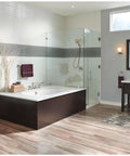 Modern bathroom with a glass shower, freestanding tub, and a Venetian Bronze Kitchen Faucet With Diamond Seal Technology Water Sense Certified.