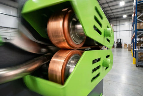 Heavy Duty High Speed Air Cushion Machine Rolls Out Bulletproof Air Pillows At Thirty Nine Feet Per Minute Cranks To Hot In Thirty Seconds For Smooth Shipping Hustle, close-up on dual heating rollers.