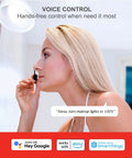 Woman using No Hub Smart Light Bulb For Google Home Control while applying makeup, demonstrating voice control feature.