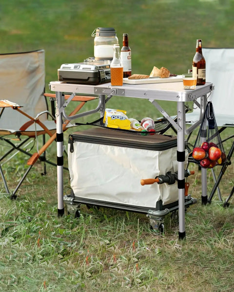 Adjustable Camping Table Folding Lightweight 5Lb Table With Four Height Levels 10 14 19.4 And 23.4 Inches Compact 23.6 By 15.7 Inches With Mesh Shelf Quick Fold Portable For Camping Picnics BBQs Garden Outdoor Dining And Cooking in outdoor setting with accessories.