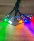 Five Pack 10mm Waterproof LED Indicator Lights Set For 3V To 9V DC With Wires 20mA 0.5W Metal Indicator Lamps In Red Orange Blue Green White For DIY Projects And Gearhead Automotive Electronics. five lit 10mm metal LED indicator lights with wires, shown in red, orange, blue, green and white