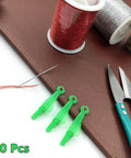 10 Pcs Fish Mouth Sewing Machine Needle Threader Set Upgraded 2024 Automatic Needle Threader Tool in green plastic on table.