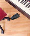 Grippy Sustain Pedal With Polarity Switch For Electronic Keyboards Digital Pianos And MIDI Keyboards on wooden floor
