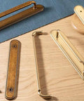 2 Pack Champagne Bronze Cabinet Pulls With Backplates, 7 1/2 Inch Center-to-Center Drawer Handles on wood surface
