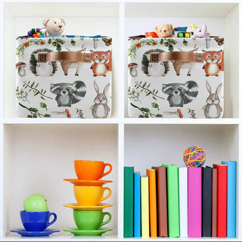 Large Foldable Storage Bin Basket With Easy Grab Reinforced Cotton Rope Handle Collapsible Fabric Laundry Hamper Rectangle Bin For Clothes And Toys Cute Woodland Animals Pattern Ideal For Bedroom Closet Laundry Room And Dorm with stuffed animals and toys inside, on a shelf with colorful books and cups.