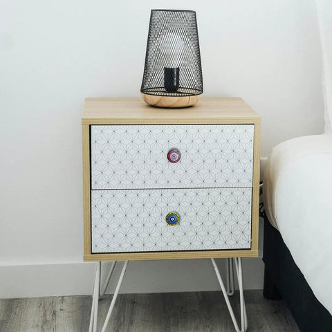 Bedside table with ceramic cabinet knobs set with vintage look hand painted multicolor mandala designs for drawers.